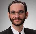 Adam E. Badik