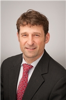 Mr. Keith E. Glidden